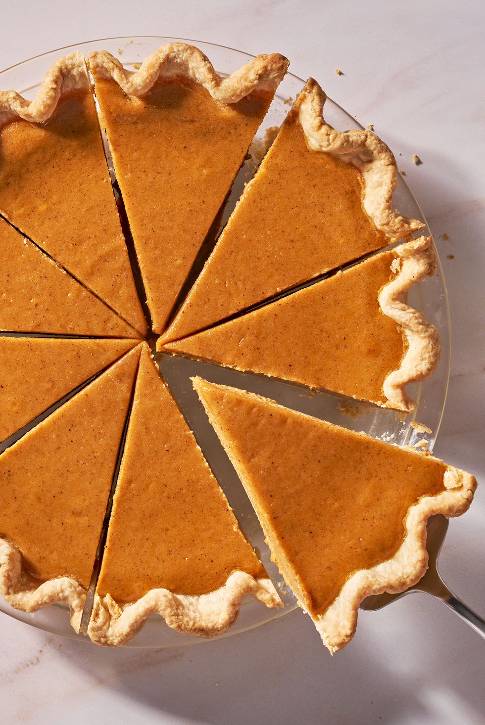 sweet potato pie with a piece coming out of it
