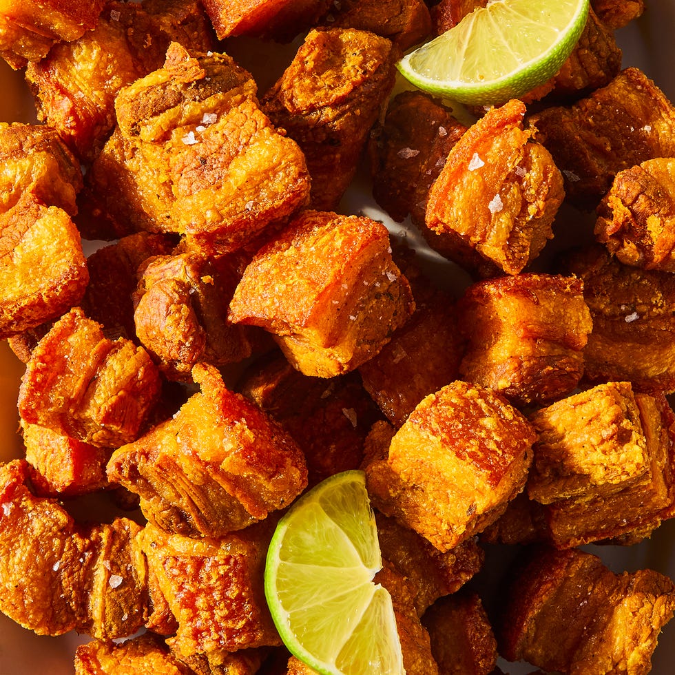 garlic, sour orange, and oregano marinated cubes of pork belly are boiled until tender then fried until deep golden brown, crunchy, and insanely juicy