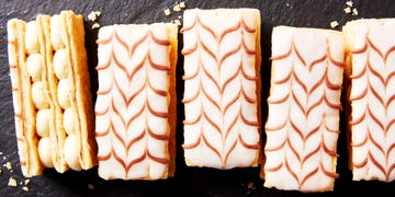 mille feuille pastries lined up on black slate