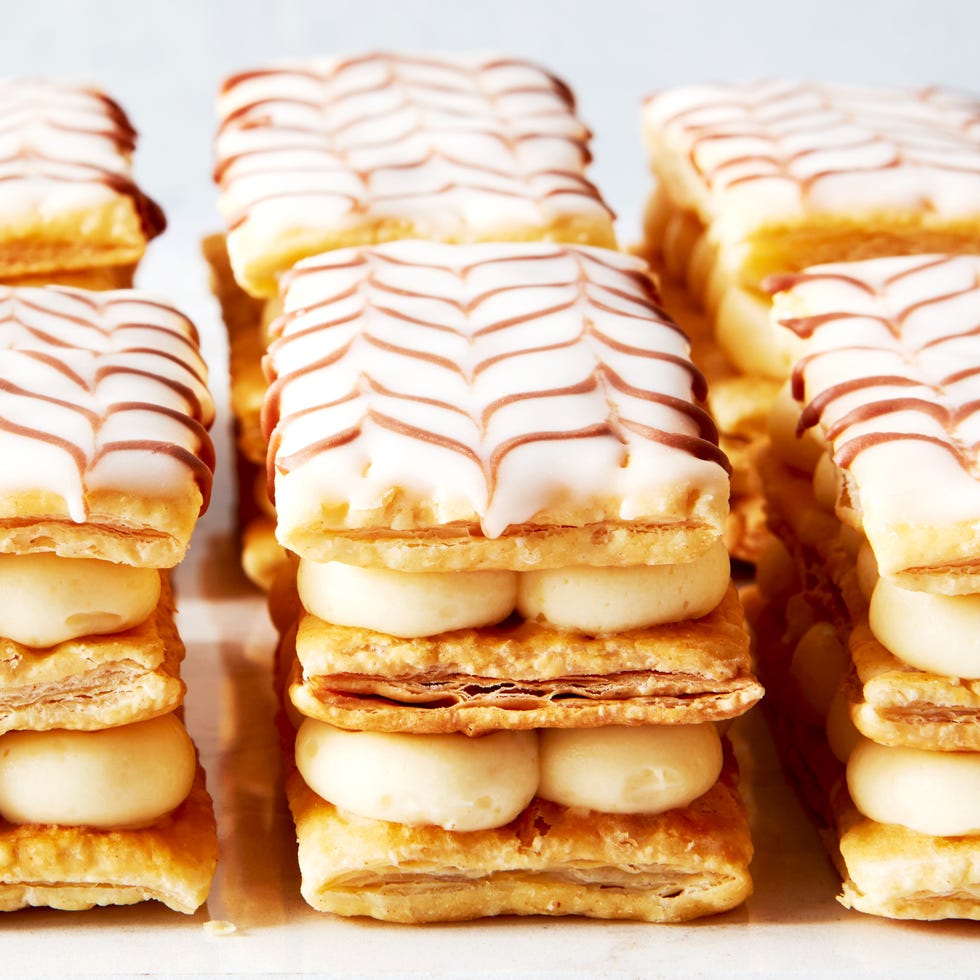 mille feuille pastries lined up on a marble platter