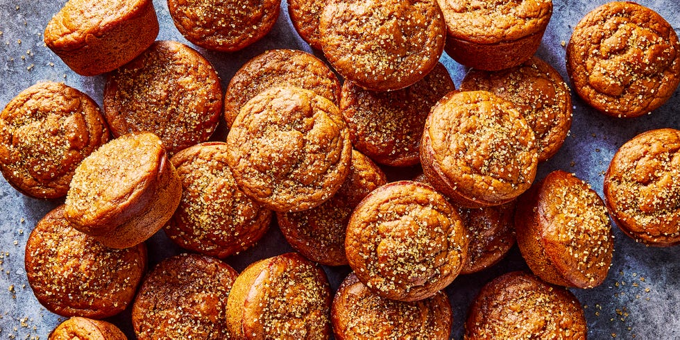 a pile of pumpkin muffins topped with coarse sugar