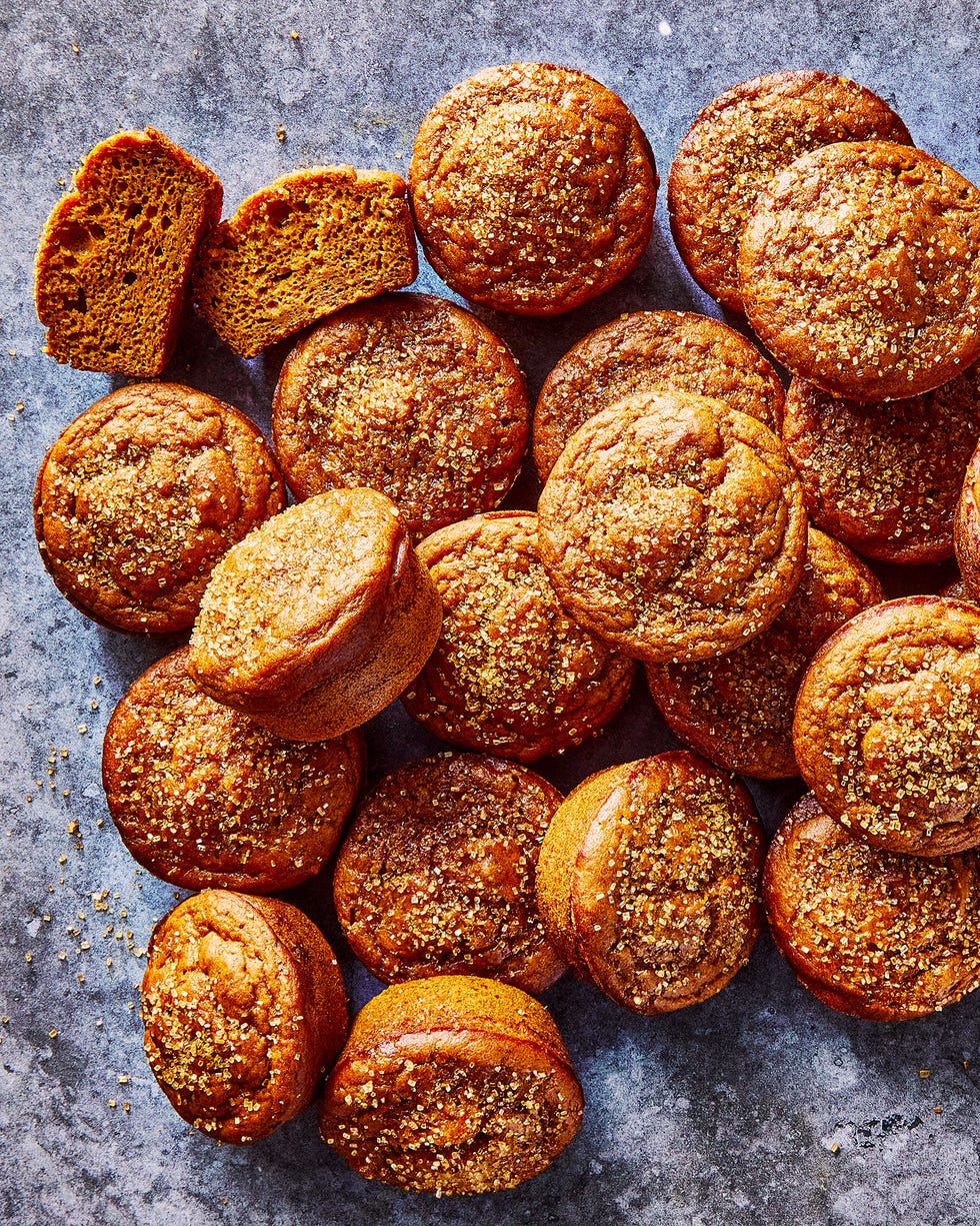 a pile of pumpkin muffins topped with coarse sugar