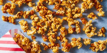 caramel sauce, honey, and roasted peanuts get tossed with popcorn and baked until crisp and crunchy