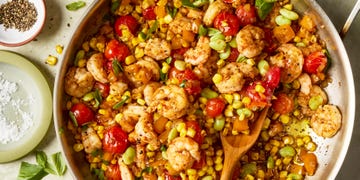 blistered tomatoes and charred corn tossed with onion, bell pepper, lima beans, and seared cajun spiced shrimp then topped with torn basil