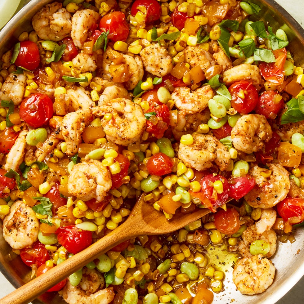 blistered tomatoes and charred corn tossed with onion, bell pepper, lima beans, and seared cajun spiced shrimp then topped with torn basil