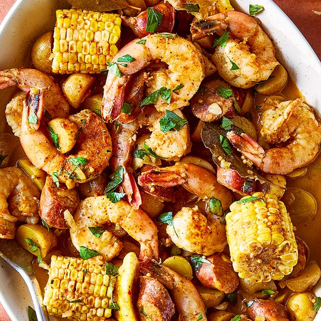 Slow Cooker Shrimp Boil baby potatoes, sweet corn, spicy sausage, and lemons swimming in a flavorful broth with juicy shrimp tossed in plenty of old bay seasoning