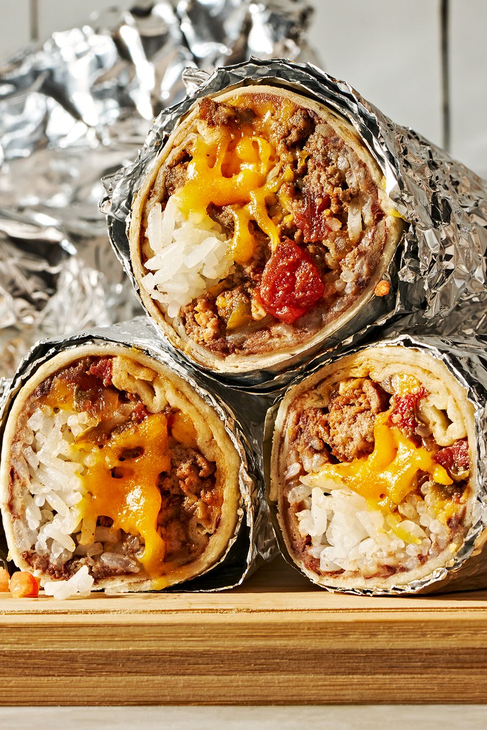 seasoned ground beef layered with refried beans, rice, and a blend of monterey jack and cheddar cheese then rolled into a flour tortilla