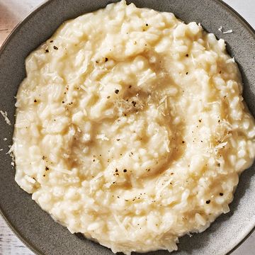 risotto on a plate topped with black pepper and parmesan