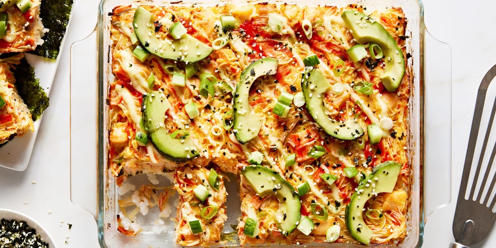 seasoned sushi rice and spicy chopped crab baked and topped with sriracha, kewpie mayo, avocado, cucumber, and furikake