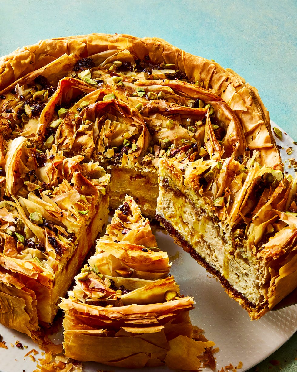 pistachio orange cheesecake with walnut and pistachio baklava crust and honey syrup