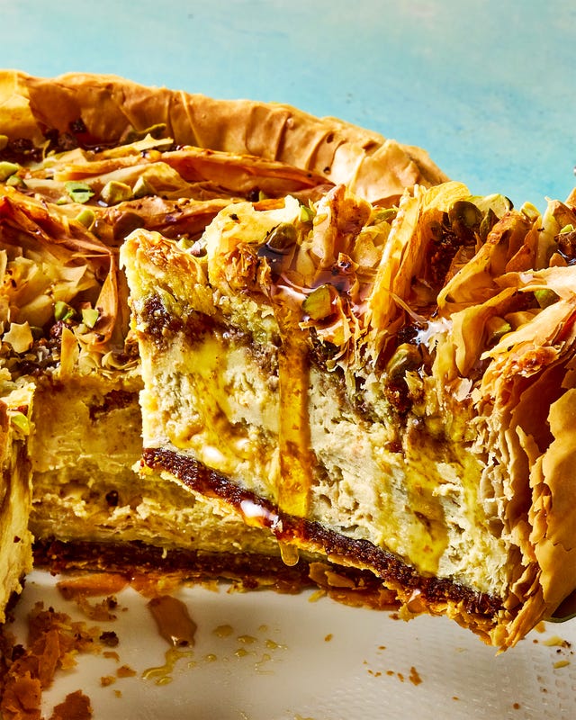 pistachio orange cheesecake with walnut and pistachio baklava crust and honey syrup
