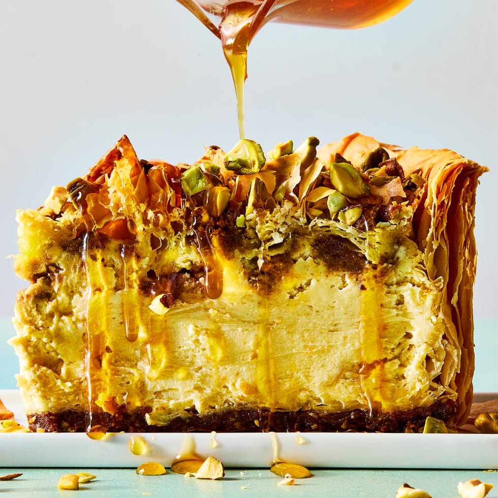 pistachio orange cheesecake with walnut and pistachio baklava crust and honey syrup