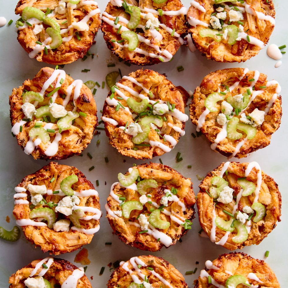 classic buffalo chicken dip with chopped chicken, cream cheese, cheddar, blue cheese, hot sauce, and chives baked into a crisp puff pastry shell until bubbling and golden