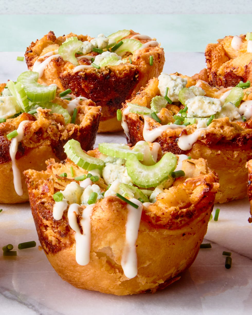 classic buffalo chicken dip with chopped chicken, cream cheese, cheddar, blue cheese, hot sauce, and chives baked into a crisp puff pastry shell until bubbling and golden