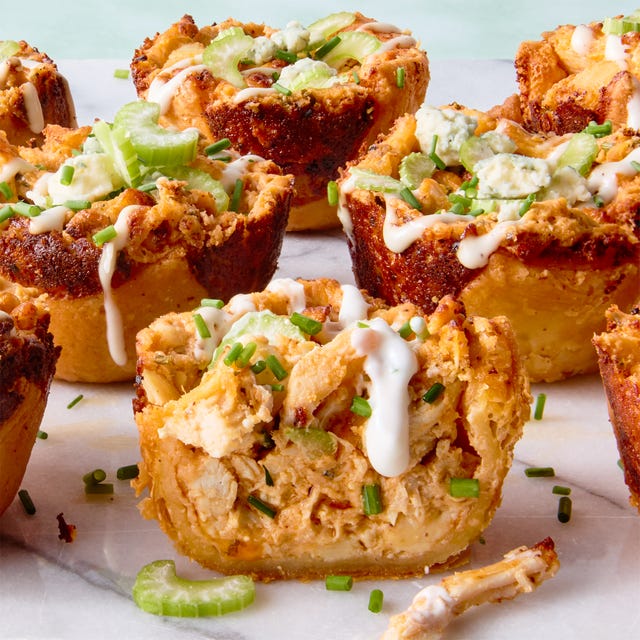 classic buffalo chicken dip with chopped chicken, cream cheese, cheddar, blue cheese, hot sauce, and chives baked into a crisp puff pastry shell until bubbling and golden