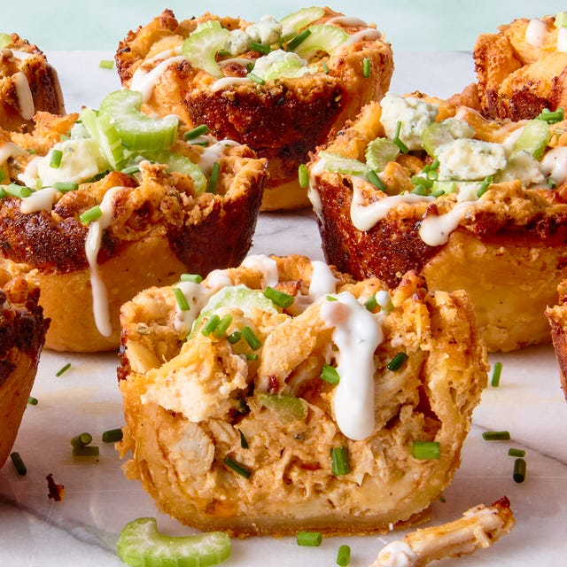 Buffalo Blitz Bites classic buffalo chicken dip with chopped chicken, cream cheese, cheddar, blue cheese, hot sauce, and chives baked into a crisp puff pastry shell until bubbling and golden