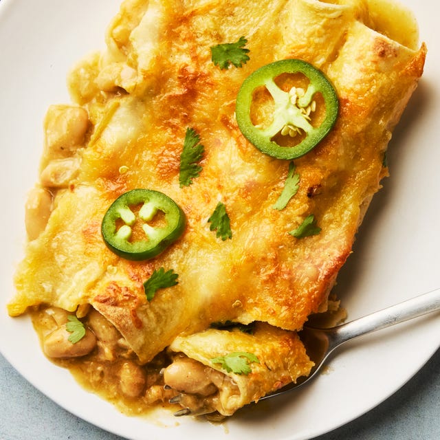 Green chili white bean enchiladas green chili white bean enchiladas on a plate with a fork