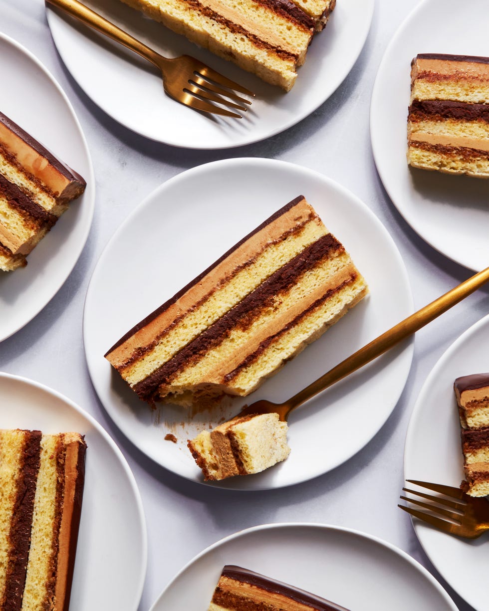 opera cake slices on plates with gold forks