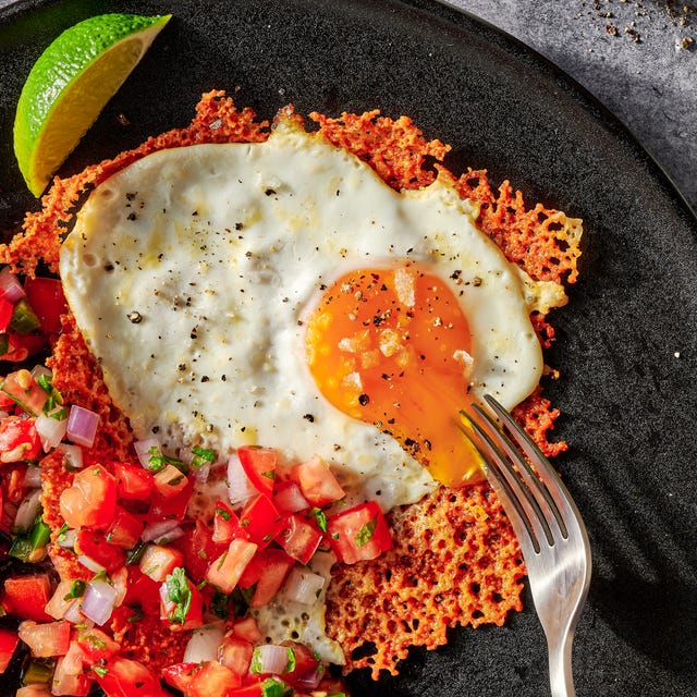 Cheesy frico fried egg tostadas cheesy frico fried egg tostadas on a black plate with pico de gallo