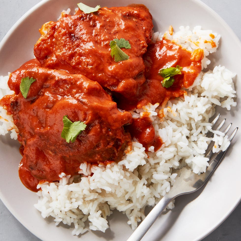 garam masala seasoned and seared chicken thighs smothered in spicy, creamy red curry sauce