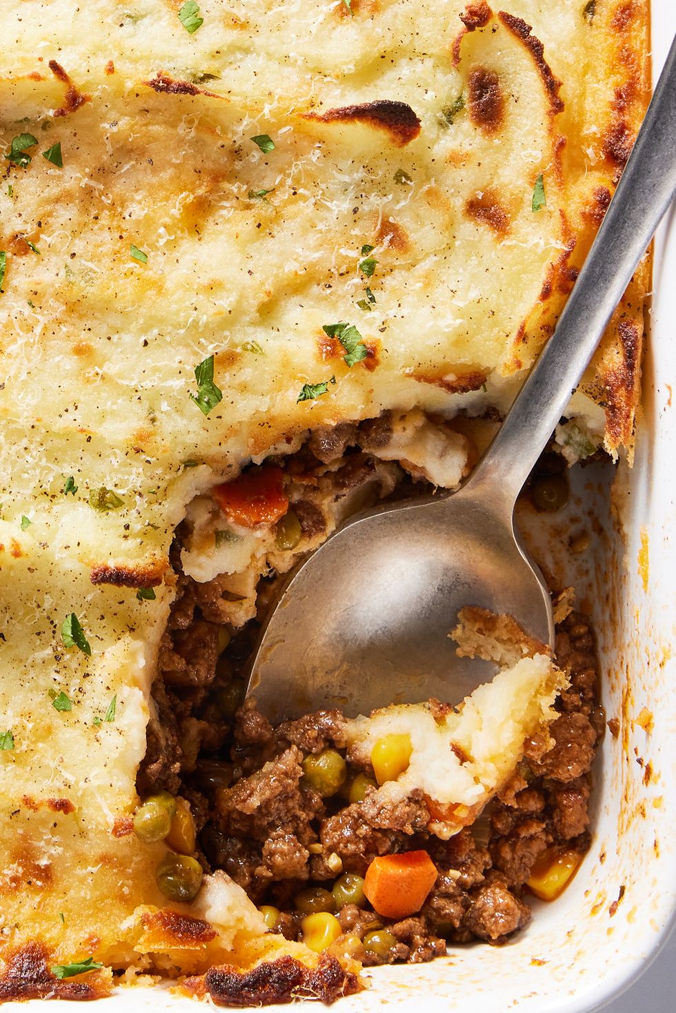 ground beef cooked with aromatics and red wine, then combined with corn and peas and covered with a blanket of velvety, rich mashed potatoes, then topped with parmesan and broiled until golden brown