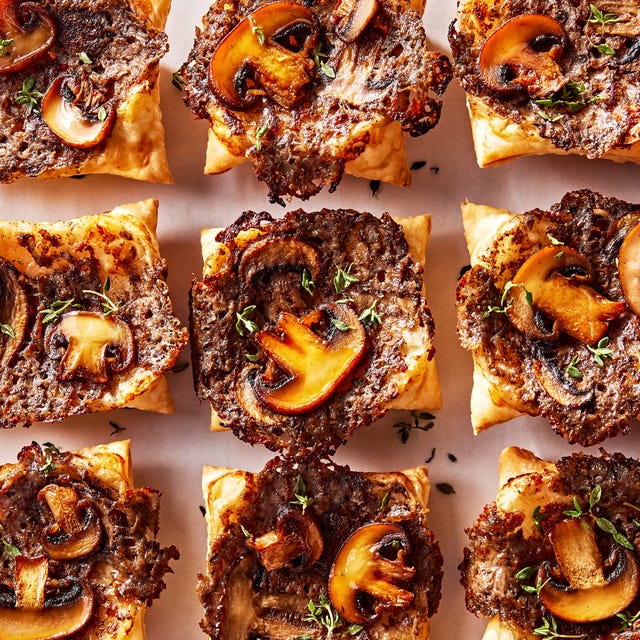 Upside-Down Cream Of Mushroom Tarts individual puff pastry squares topped with a cheesy mushroom duxelles, slices of roasted mushrooms, and fresh thyme
