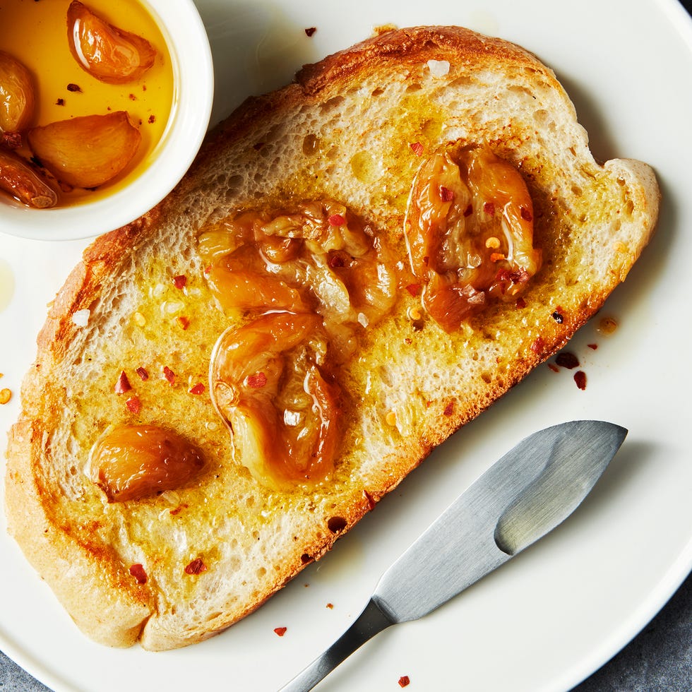fresh garlic slow roasted in olive oil and crushed red pepper until soft, spreadable, and slightly sweet