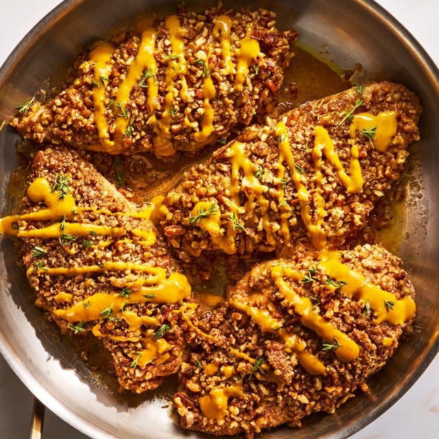 chicken cutlets are tossed in a punchy and herby maple mustard sauce, then topped with chopped pecans and baked to juicy, crunchy perfection