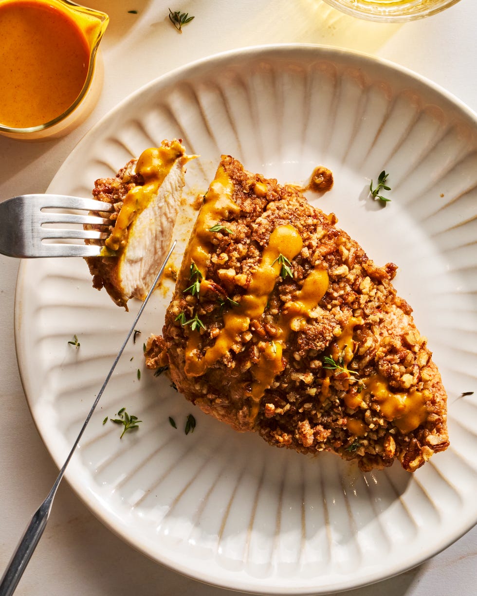 chicken cutlets are tossed in a punchy and herby maple mustard sauce, then topped with chopped pecans and baked to juicy, crunchy perfection