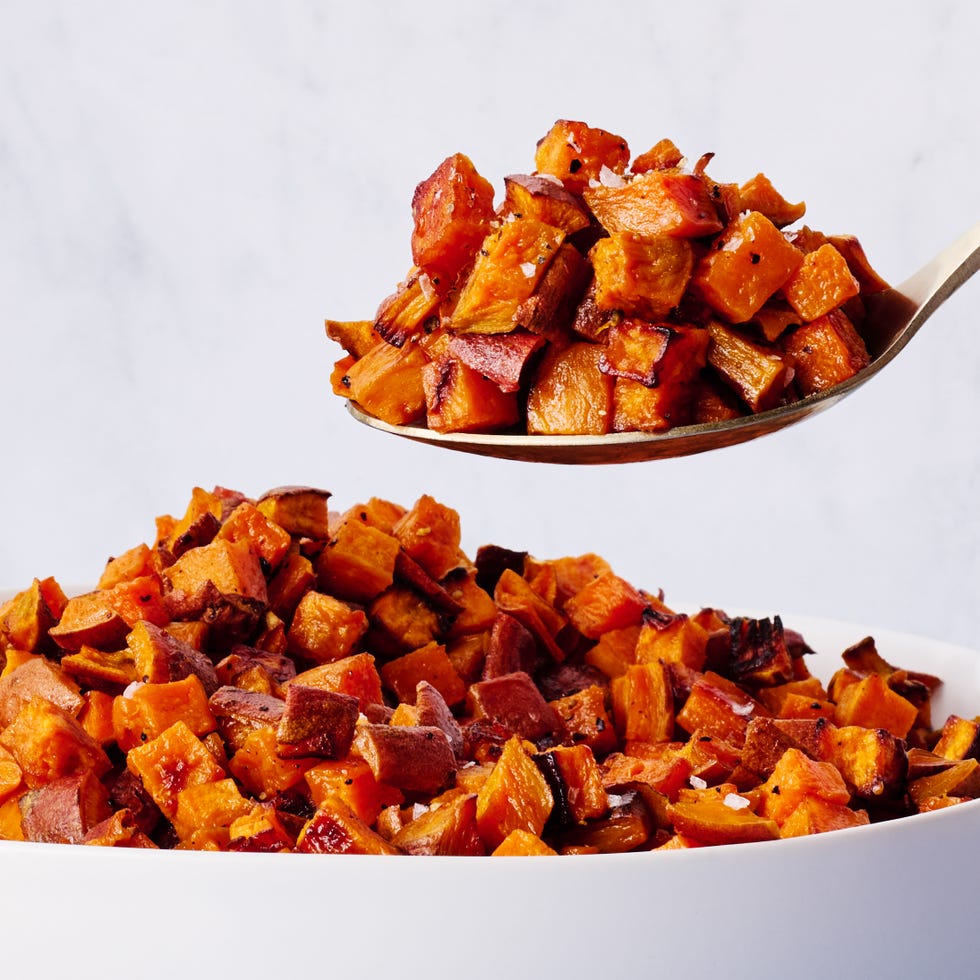roasted sweet potatoes in a spoon over a bowl