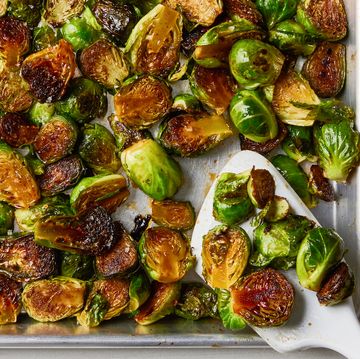 caramelized brussels sprouts on a silver sheet pan