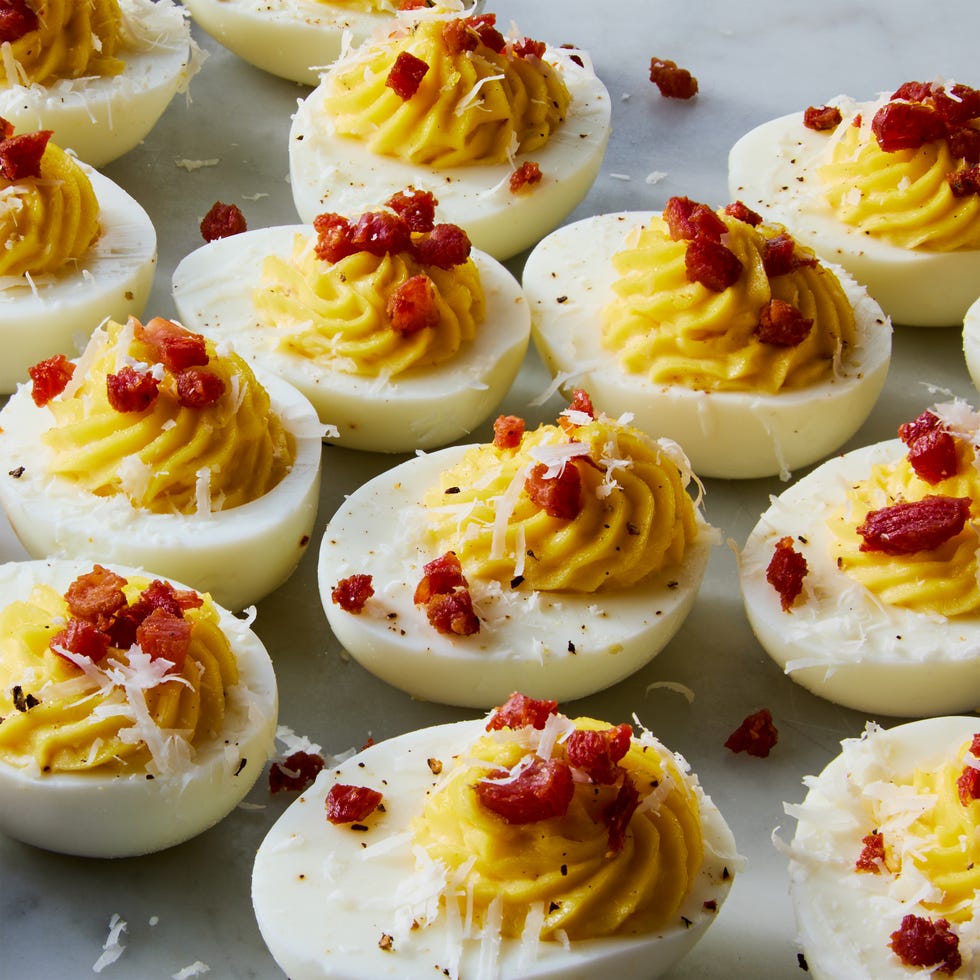 carbonara deviled eggs topped with pecorino romano and crispy pancetta