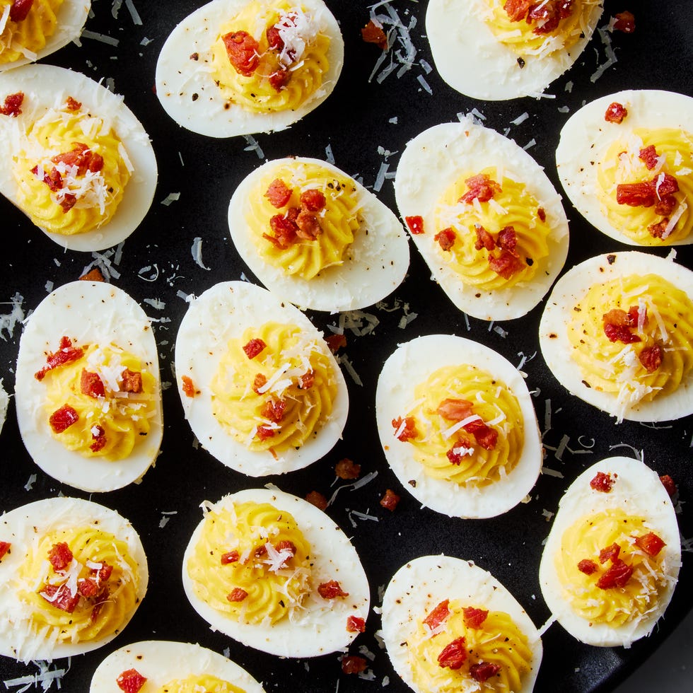 carbonara deviled eggs topped with pecorino romano and crispy pancetta