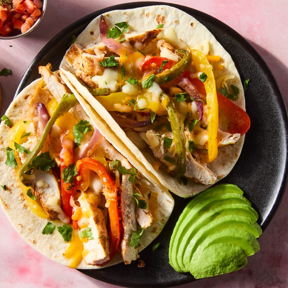 chipotle chile and cumin seasoned chicken breast is nestled into fire roasted tomato rice topped with strips of jalapeno, bell pepper, and sweet red onion then smothered with a three cheese blend and baked