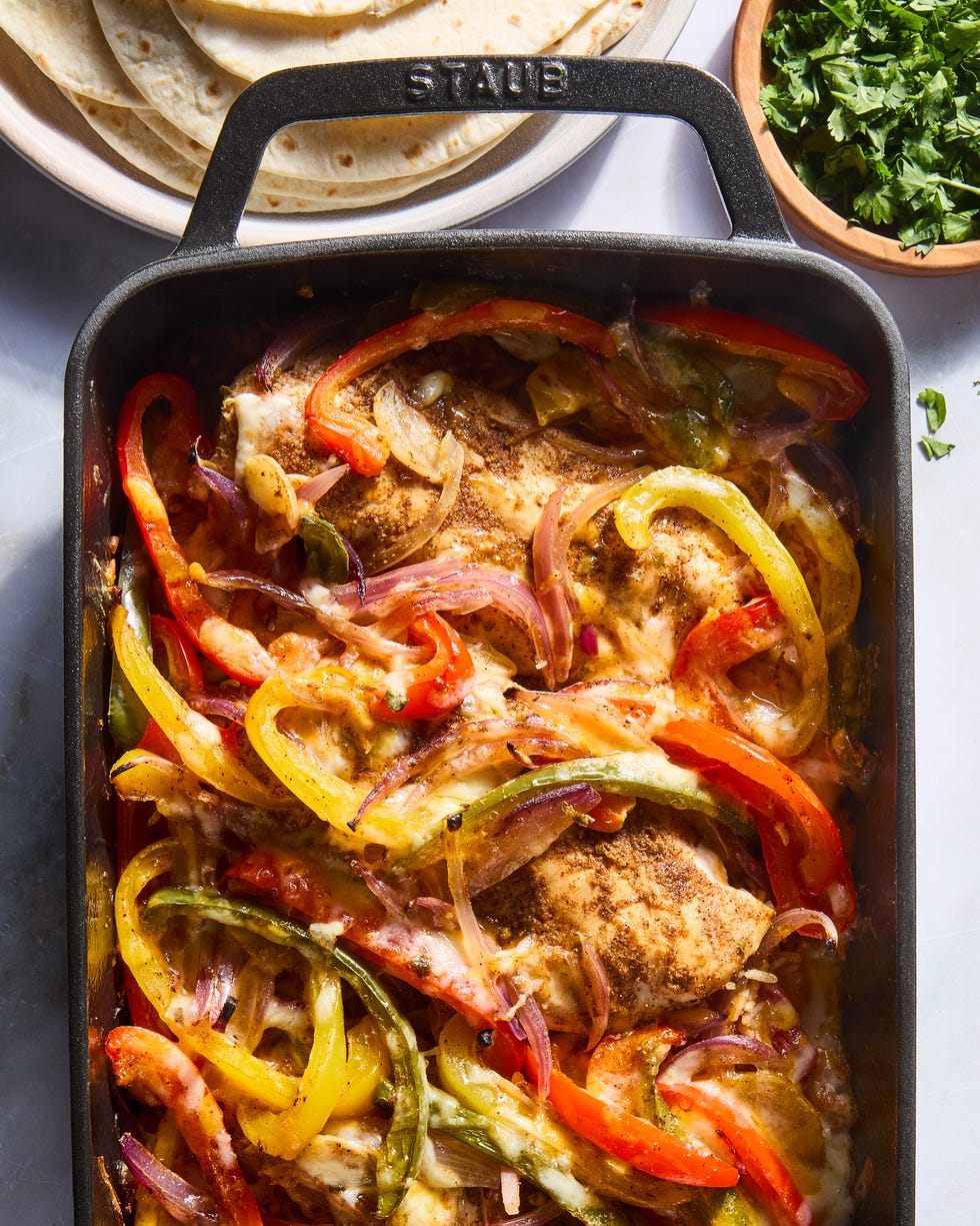 chipotle chile and cumin seasoned chicken breast is nestled into fire roasted tomato rice topped with strips of jalapeno, bell pepper, and sweet red onion then smothered with a three cheese blend and baked