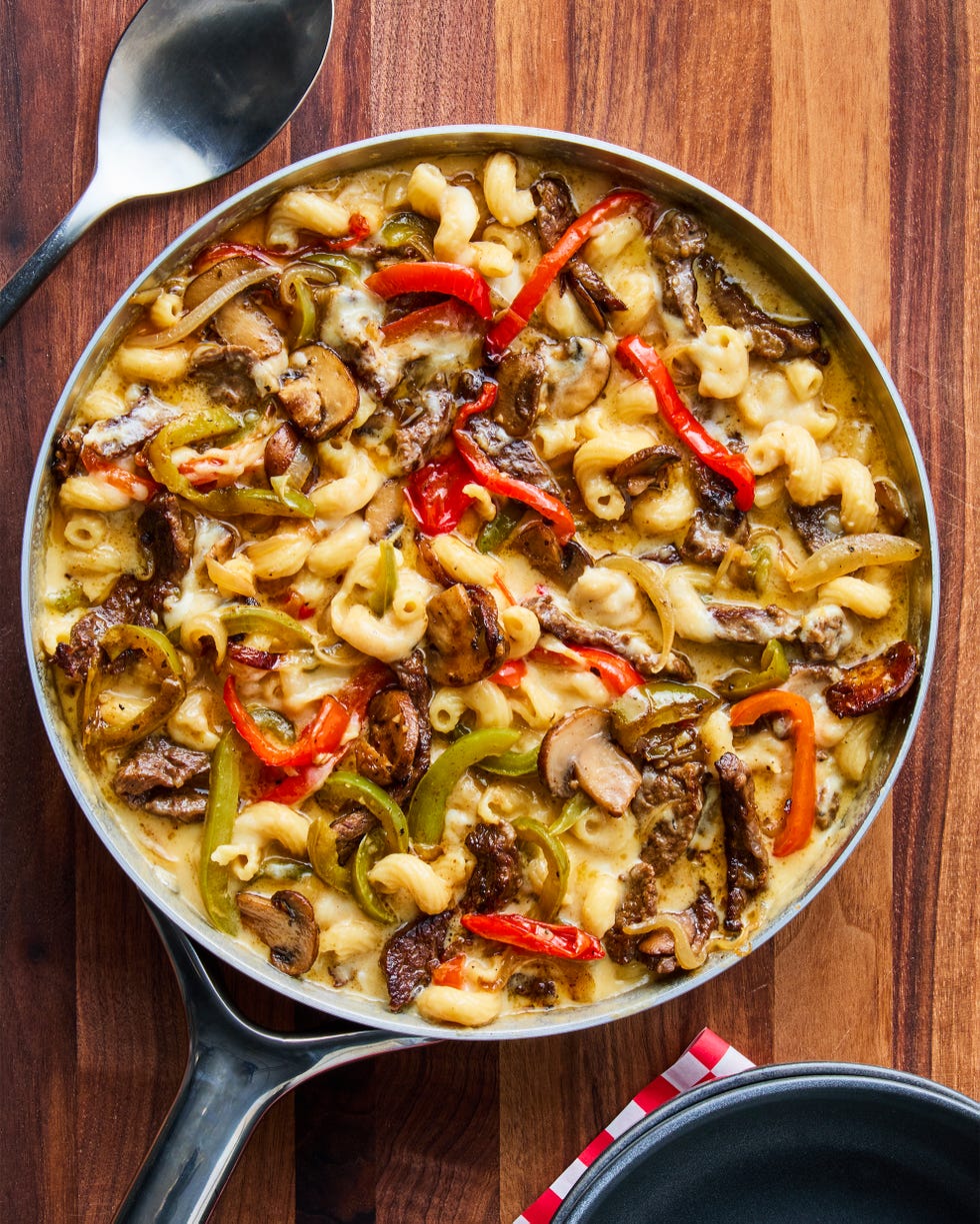 cheesy pasta skillet with tender skirt steak, sauteed peppers, onions, and mushrooms, and creamy provolone