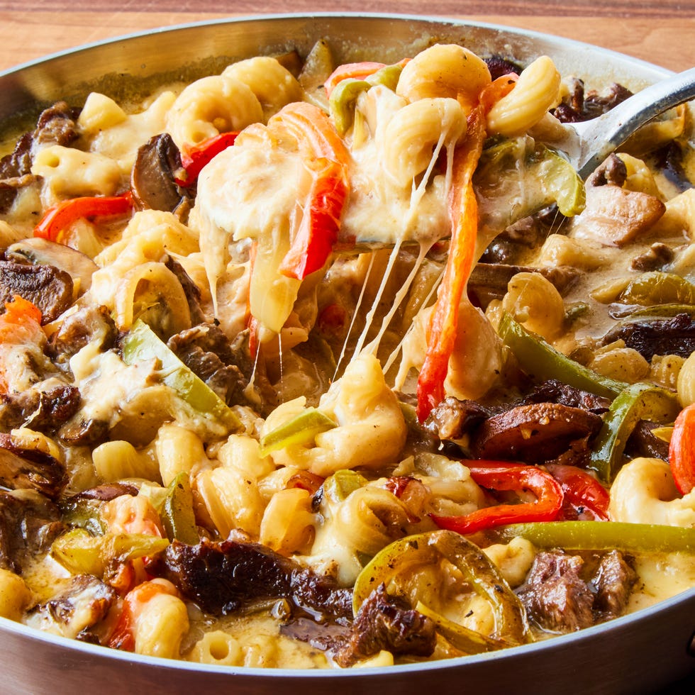 cheesy pasta skillet with tender skirt steak, sauteed peppers, onions, and mushrooms, and creamy provolone