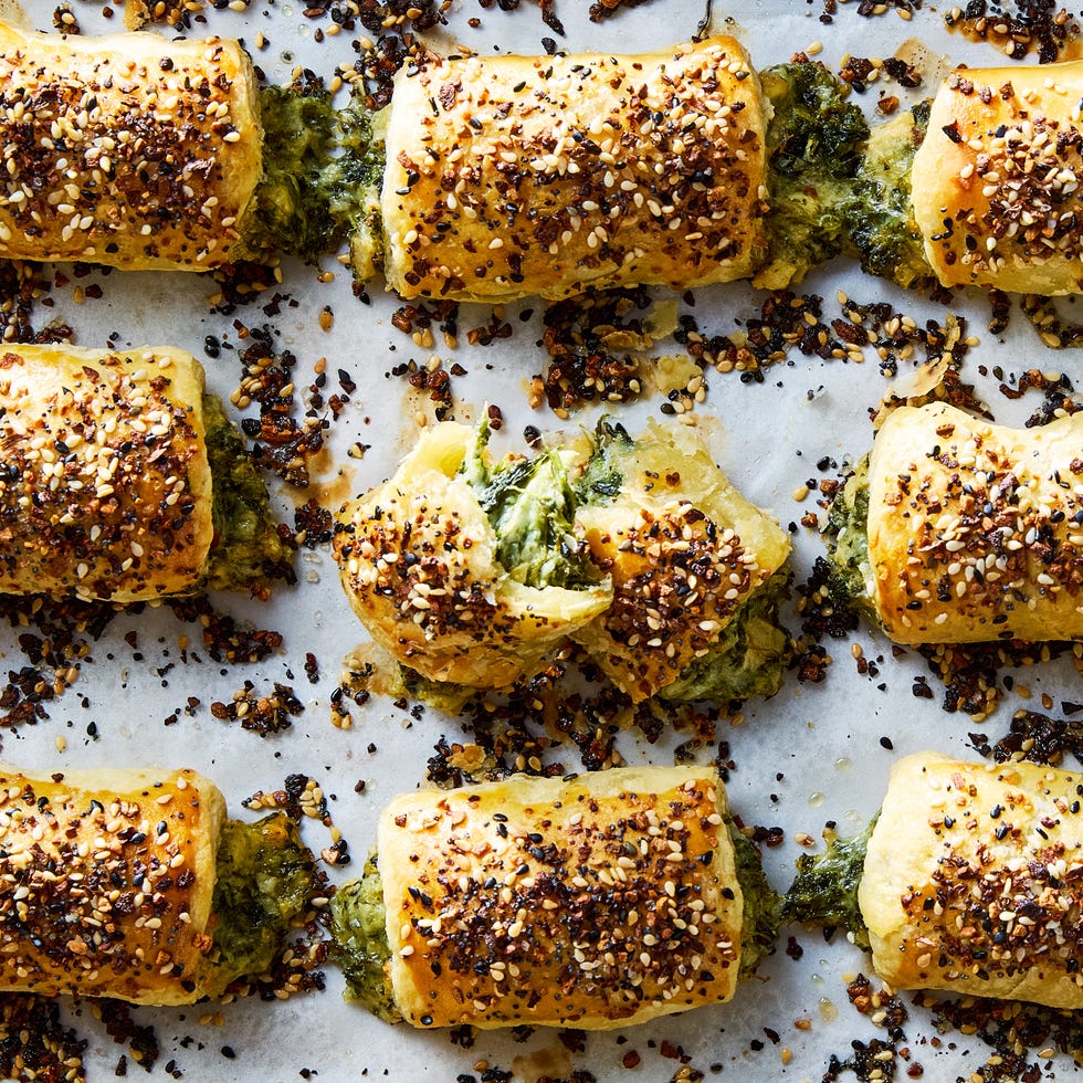 chopped spinach, marinated artichokes, and three types of cheese rolled into flaky puff pastry, topped with everything bagel seasoning, and baked until golden brown