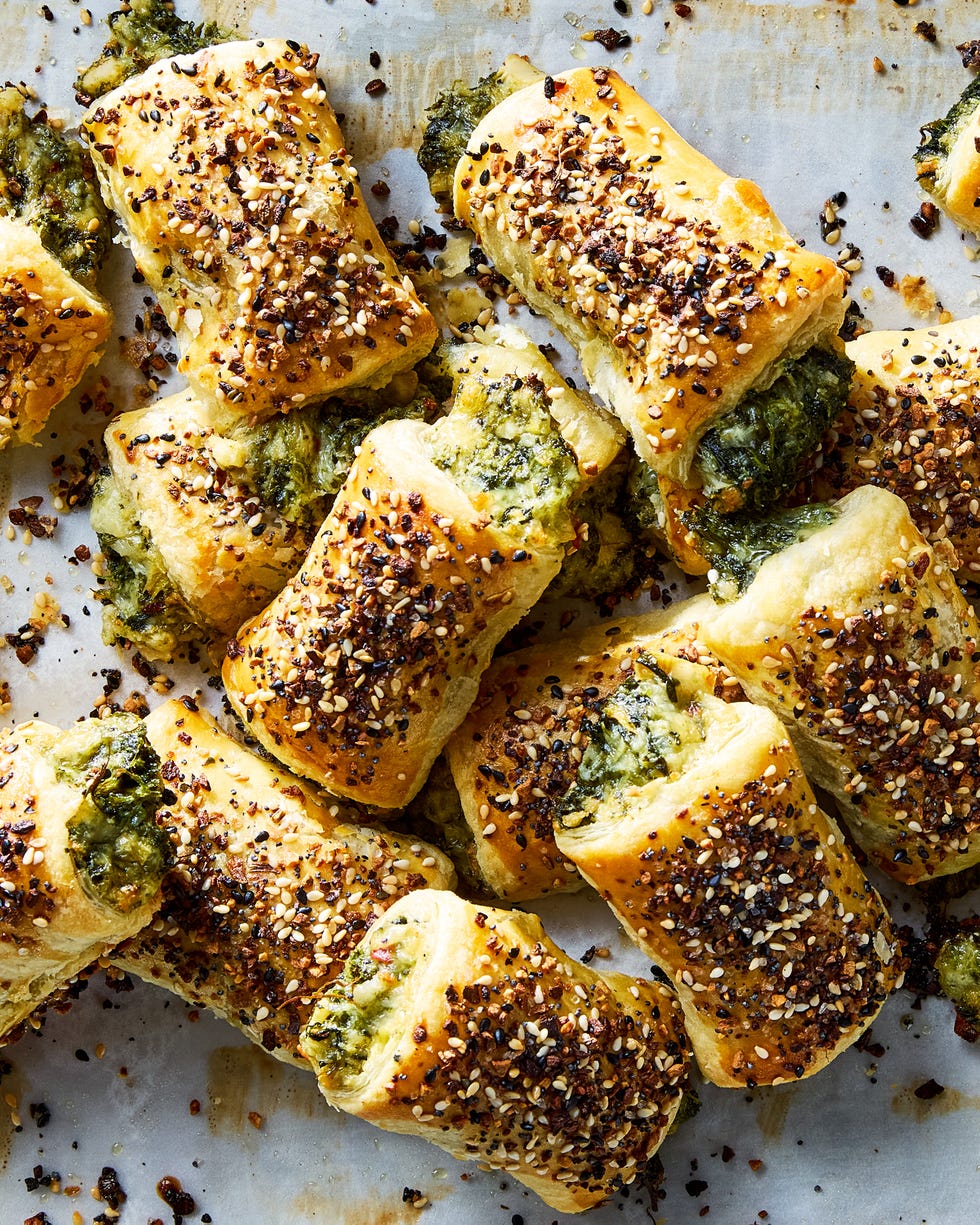 chopped spinach, marinated artichokes, and three types of cheese rolled into flaky puff pastry, topped with everything bagel seasoning, and baked until golden brown