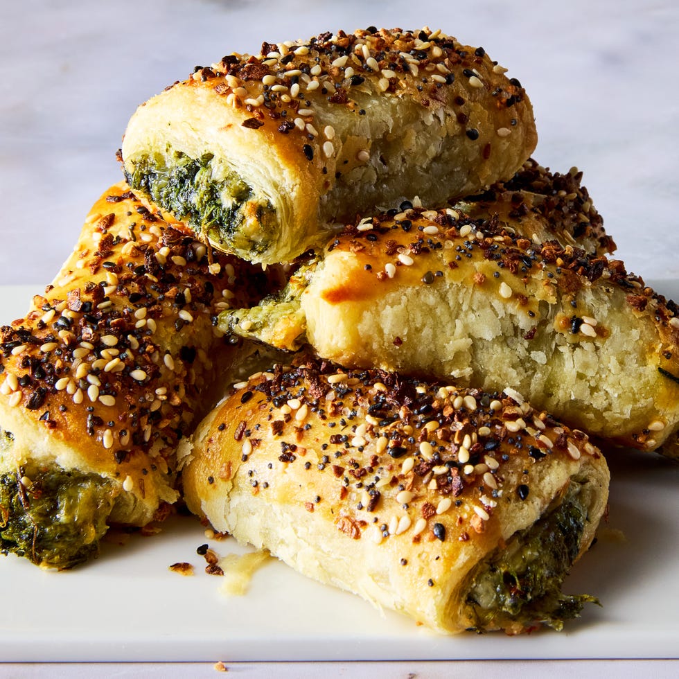 chopped spinach, marinated artichokes, and three types of cheese rolled into flaky puff pastry, topped with everything bagel seasoning, and baked until golden brown