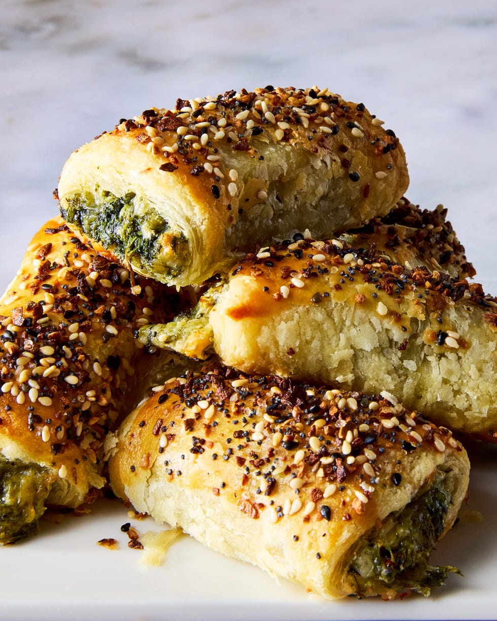 chopped spinach, marinated artichokes, and three types of cheese rolled into flaky puff pastry, topped with everything bagel seasoning, and baked until golden brown