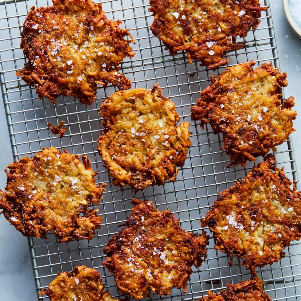 crispy golden latkes resting on a wire rack