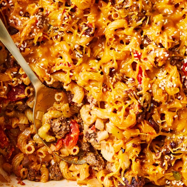 a casserole dish filled with elbow macaroni, ground beef, and a creamy sauce