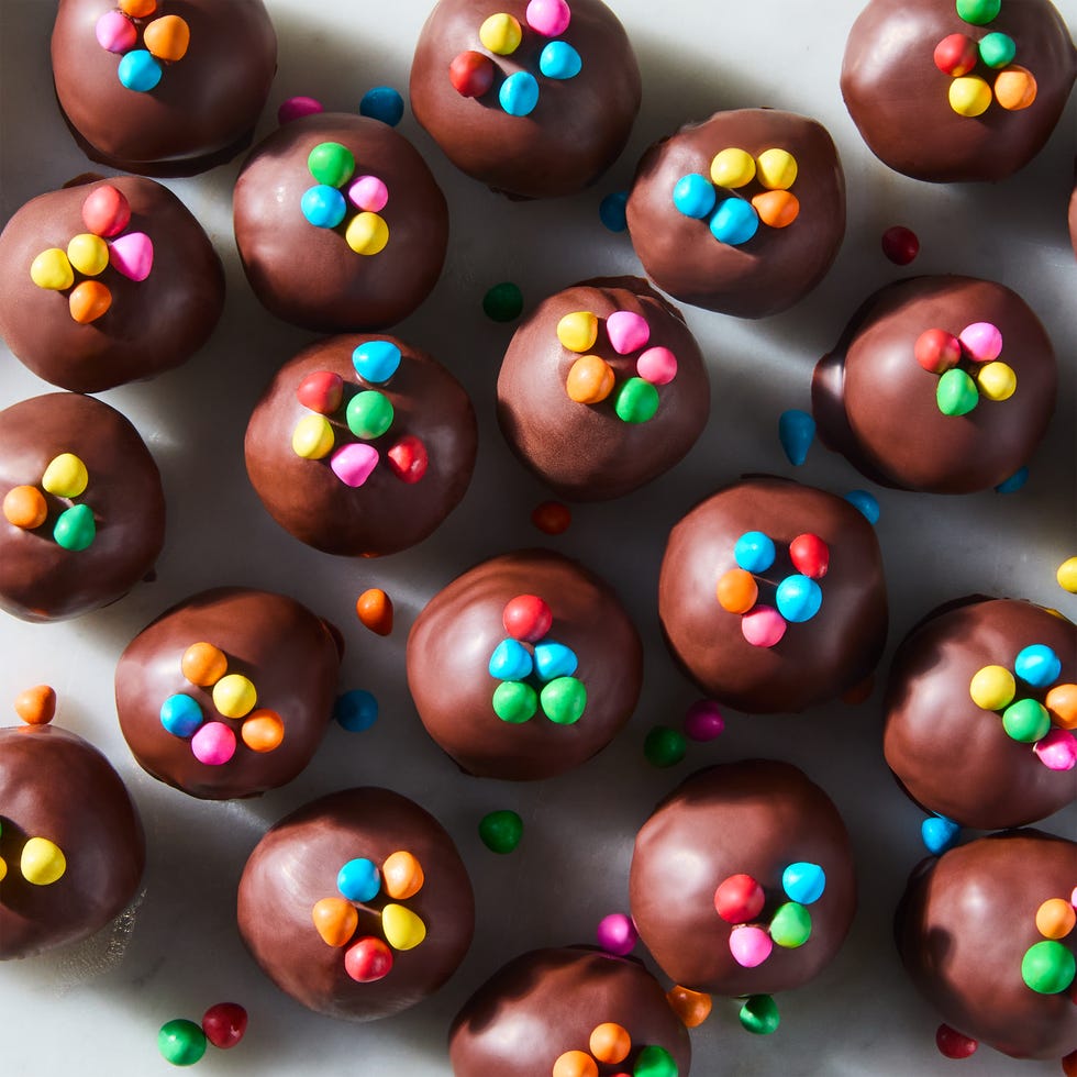 cosmic brownie protein bites topped with rainbow chocolate chips