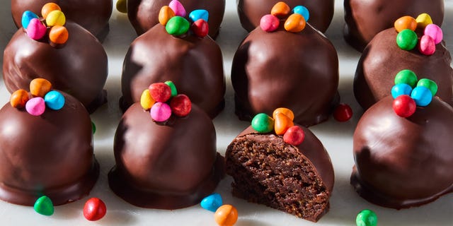 cosmic brownie protein bites lined up on a counter