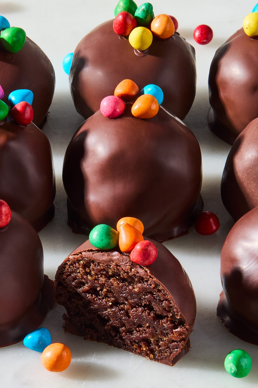 Cosmic brownie protein bites cosmic brownie protein bites sitting in rows on a counter