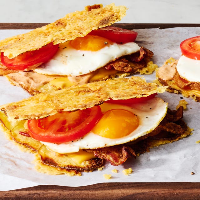 Crispy Potato Bacon, Egg, & Cheese smoky bacon a runny egg melty american cheese and spicy mayo are wrapped in a layer of parmesan crusted crispy potatoes
