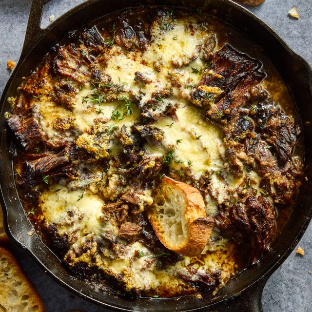 French Onion Pot Roast onion seasoned beef is nestled in a bed of cooked onions, red wine, fresh thyme, and beef broth, then braised until ridiculously tender, shredded, and topped with nutty, salty gruyere cheese