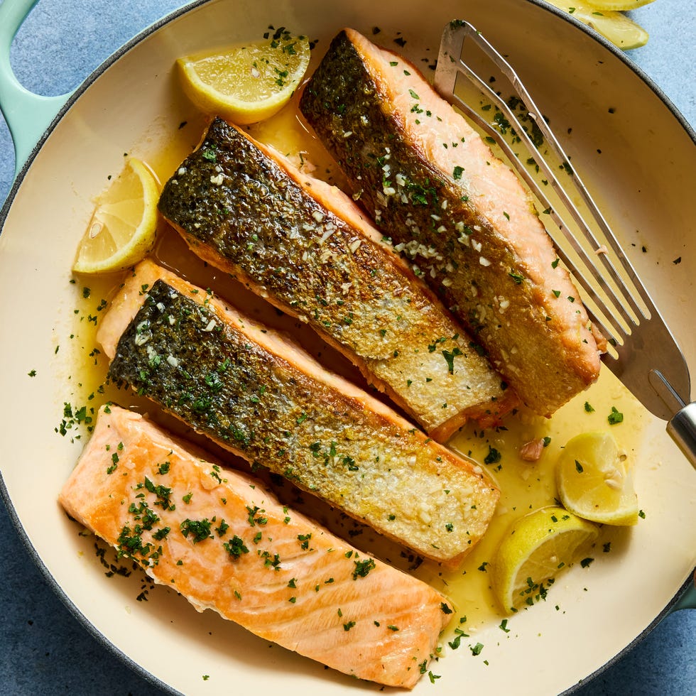 hearty salmon filets are generously seasoned with salt and pan seared in browned butter lemon zest and lemon juice, then topped with a flurry of freshly chopped herbs