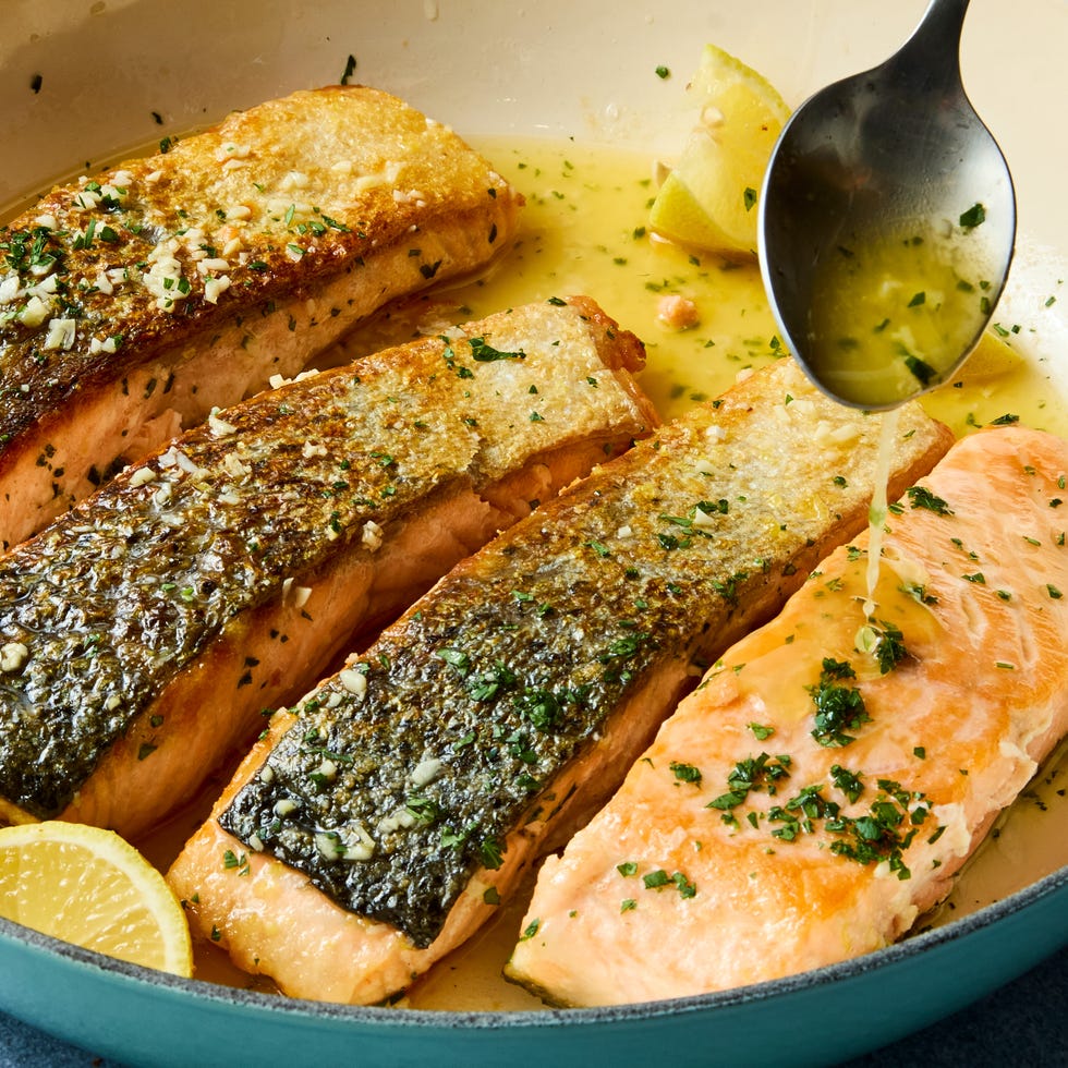 hearty salmon filets are generously seasoned with salt and pan seared in browned butter lemon zest and lemon juice, then topped with a flurry of freshly chopped herbs
